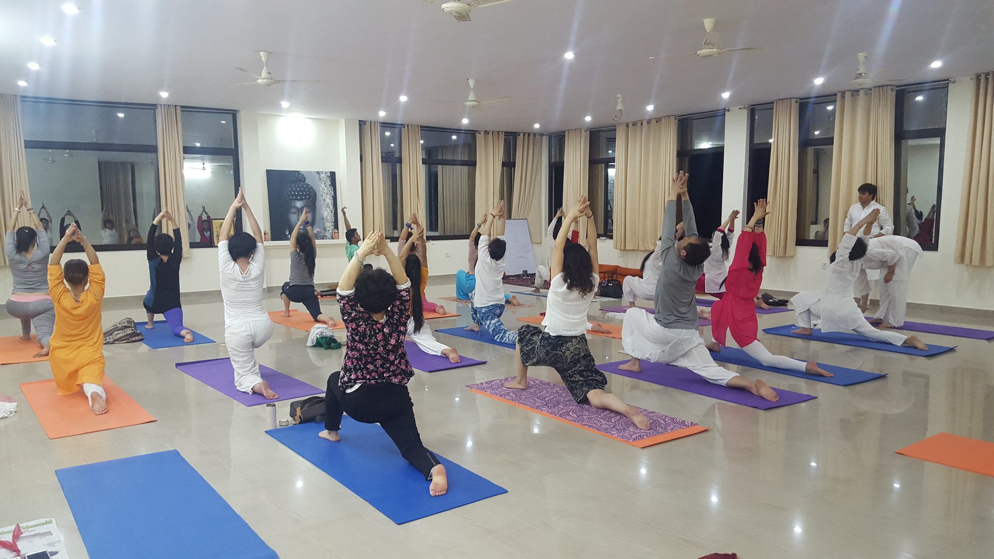 A yoga class in progress at a yoga school in Rishikesh